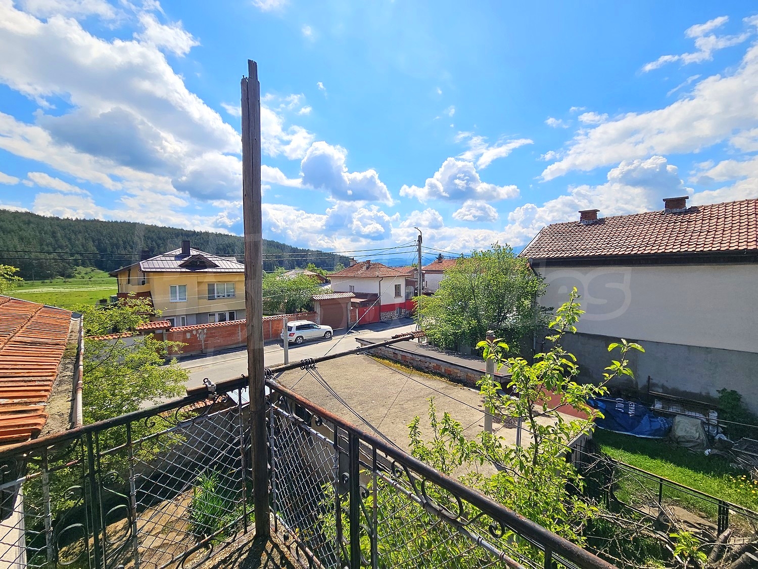 outside, view from balcony, green area