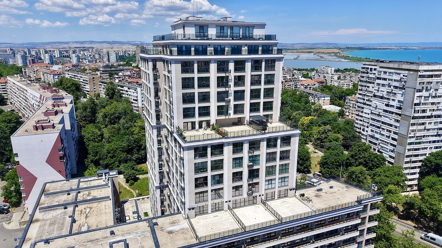 facade, outside, view from balcony, sea, green area