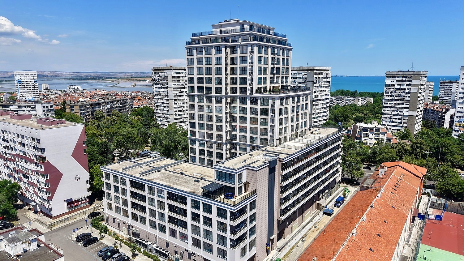 outside, facade, sea, view from balcony, parking, green area