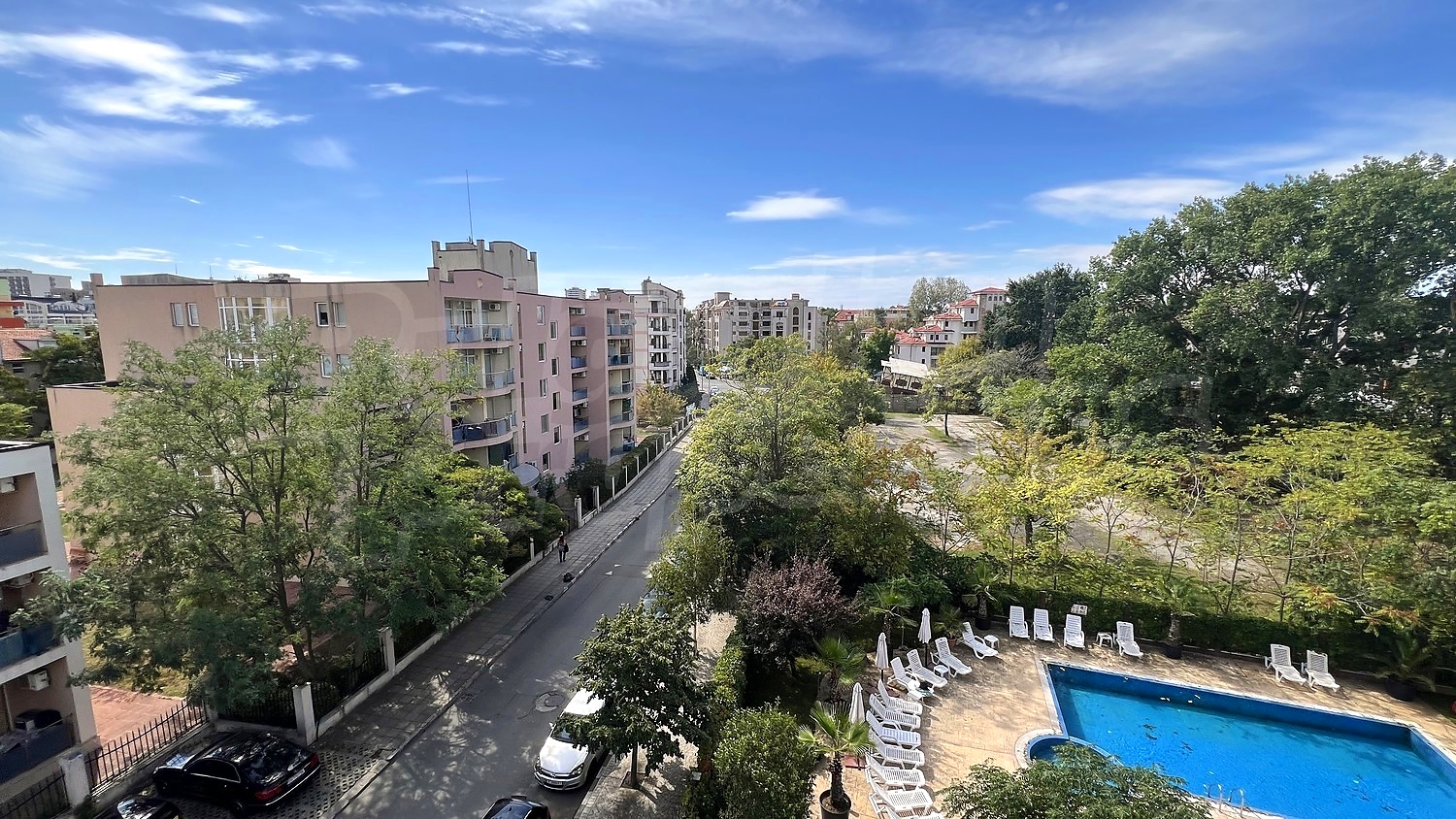 outside, view from balcony, pool, green area