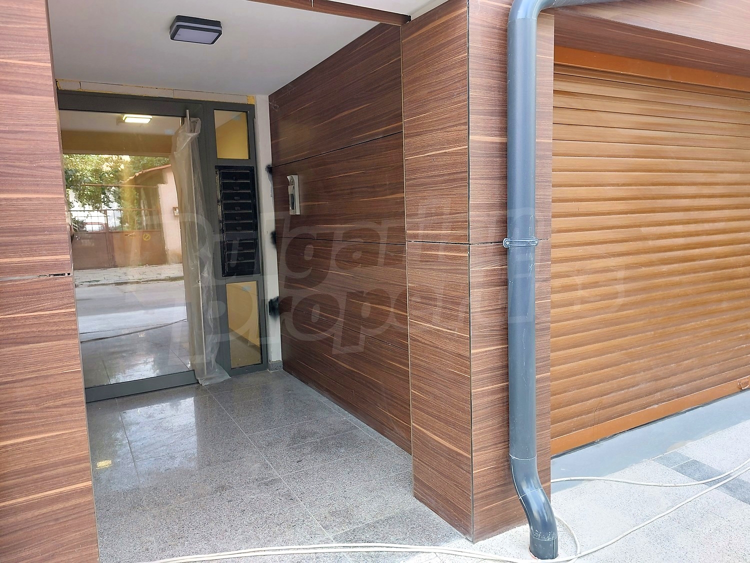 outside, inside building entrance