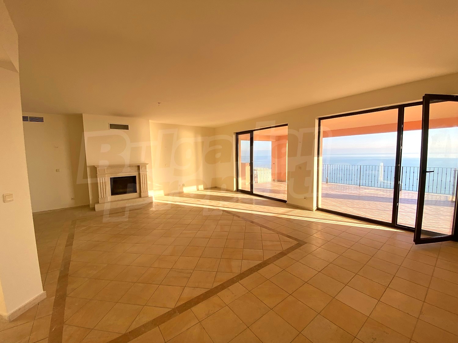 inside, living room, fireplace, balcony, view from balcony, sea