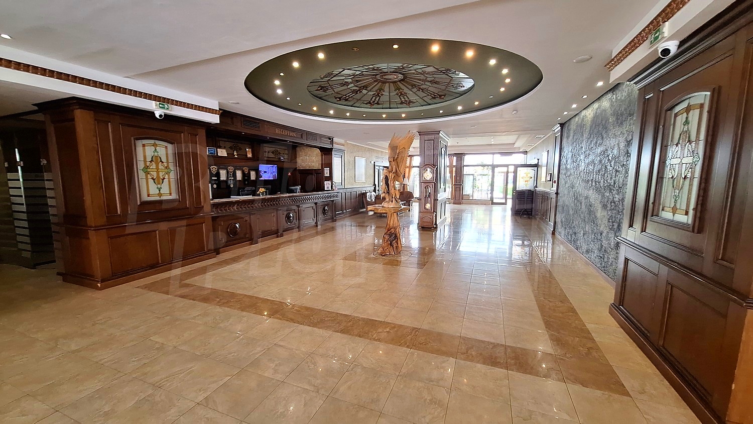 inside, inside building entrance, hallway, furnished