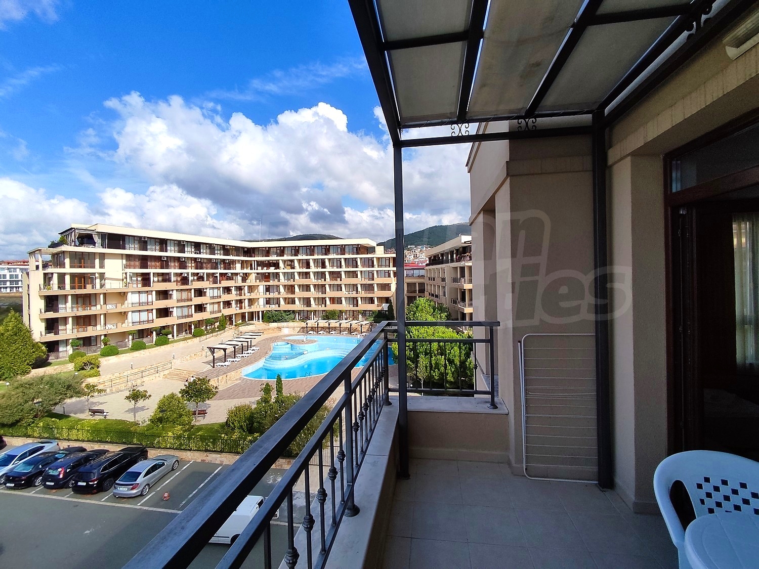 balcony, view from balcony, pool, parking, outside