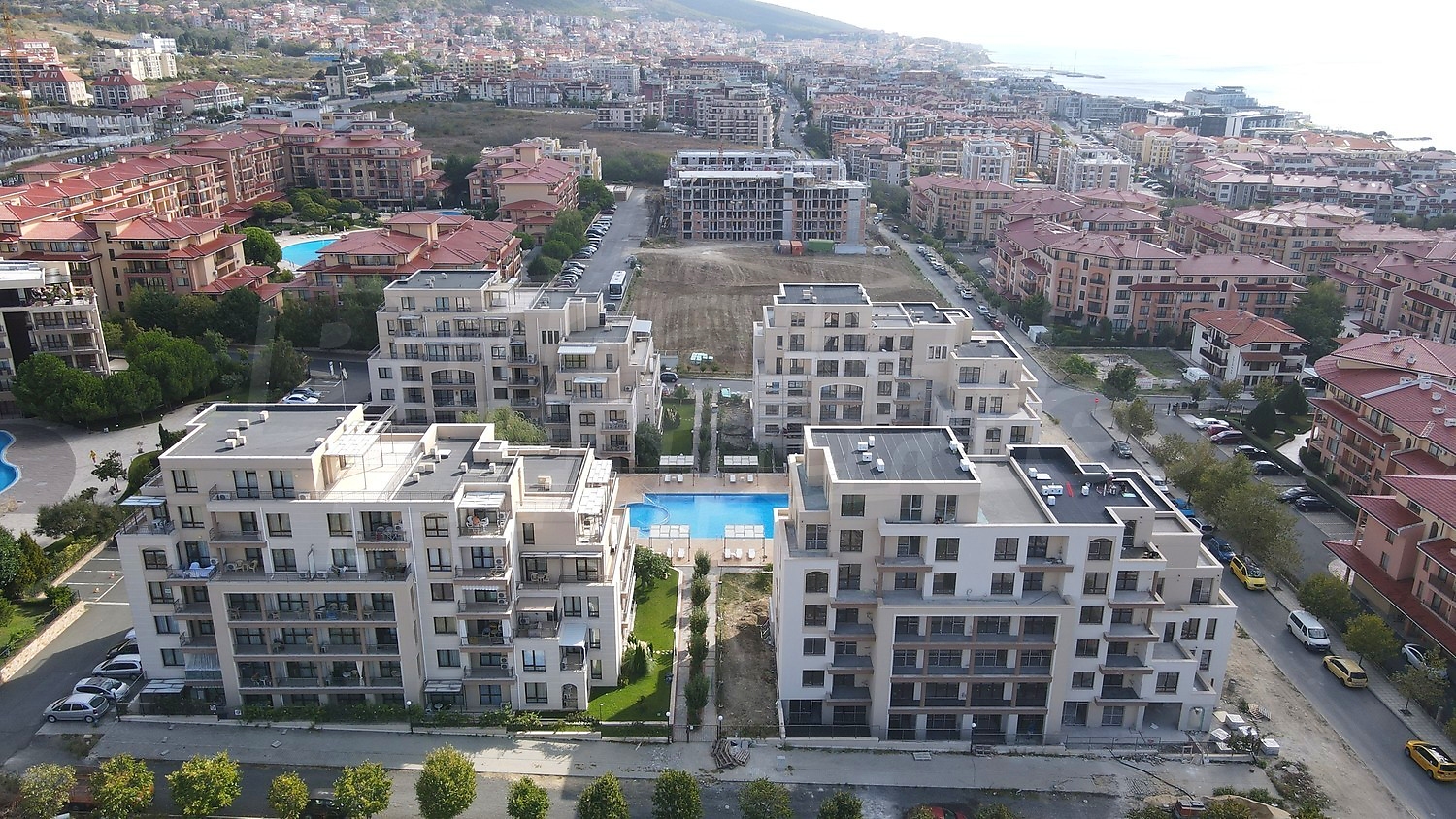 outside, facade, view from balcony, pool, parking