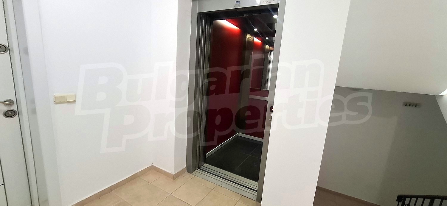 inside building entrance, hallway, stairs