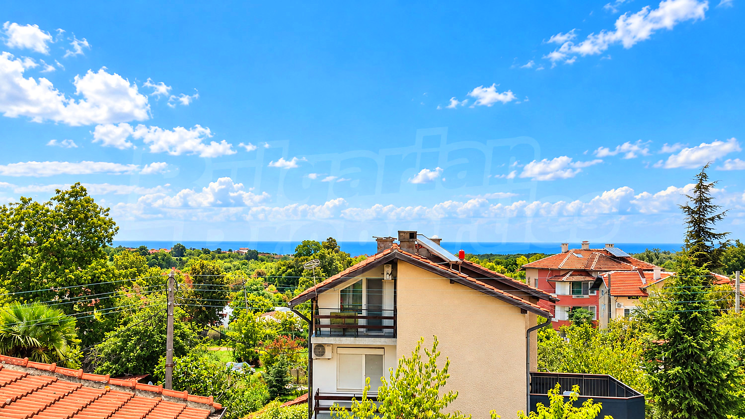 view from balcony, outside, sea, green area