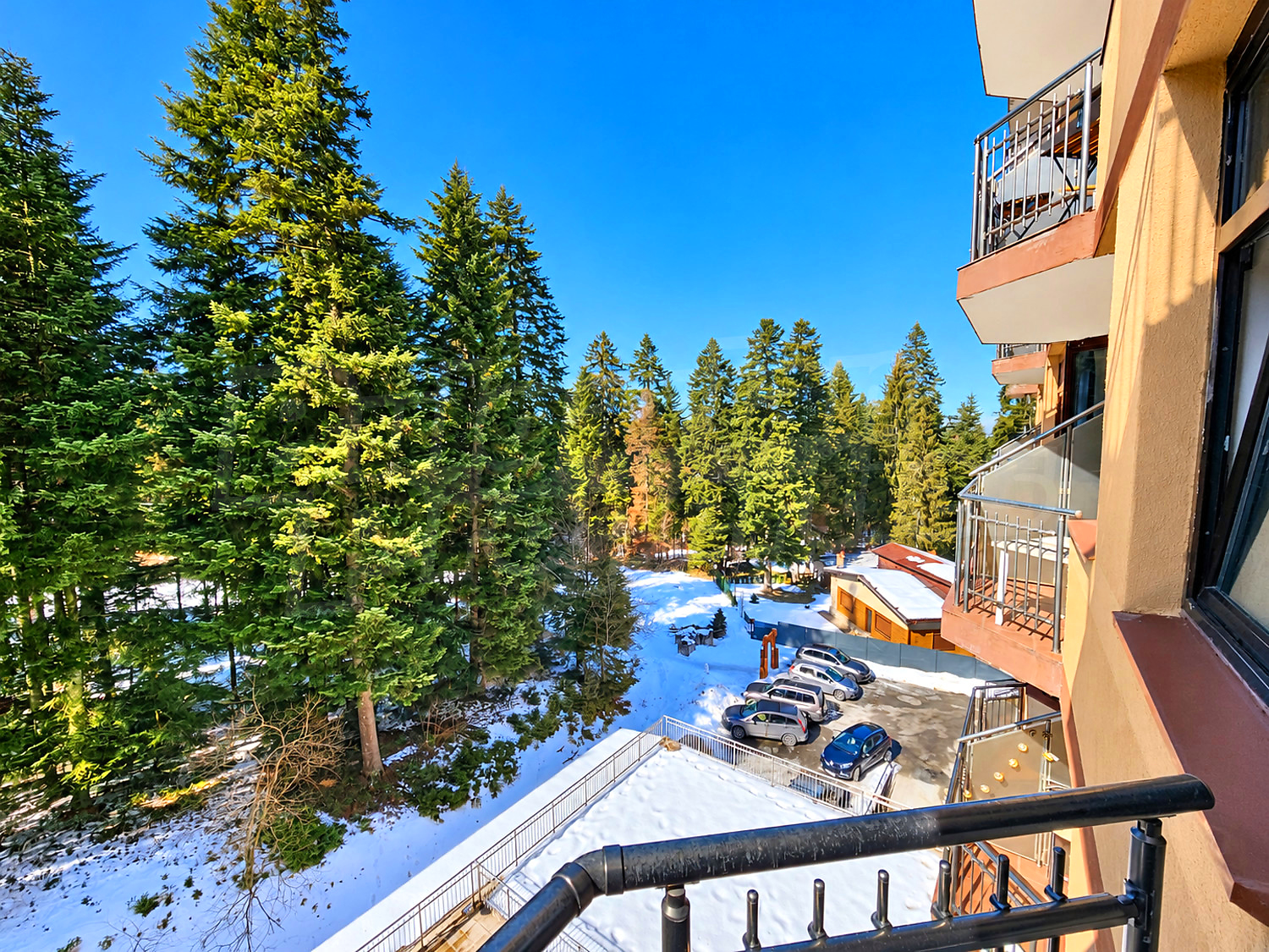 balcony, outside, view from balcony, parking, mountain, green area
