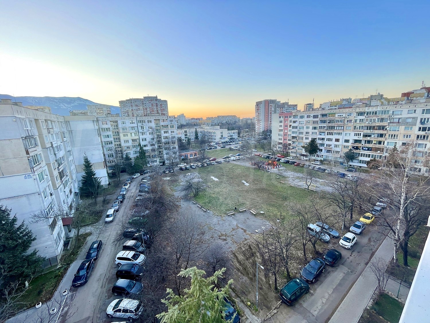 outside, parking, facade, green area, mountain