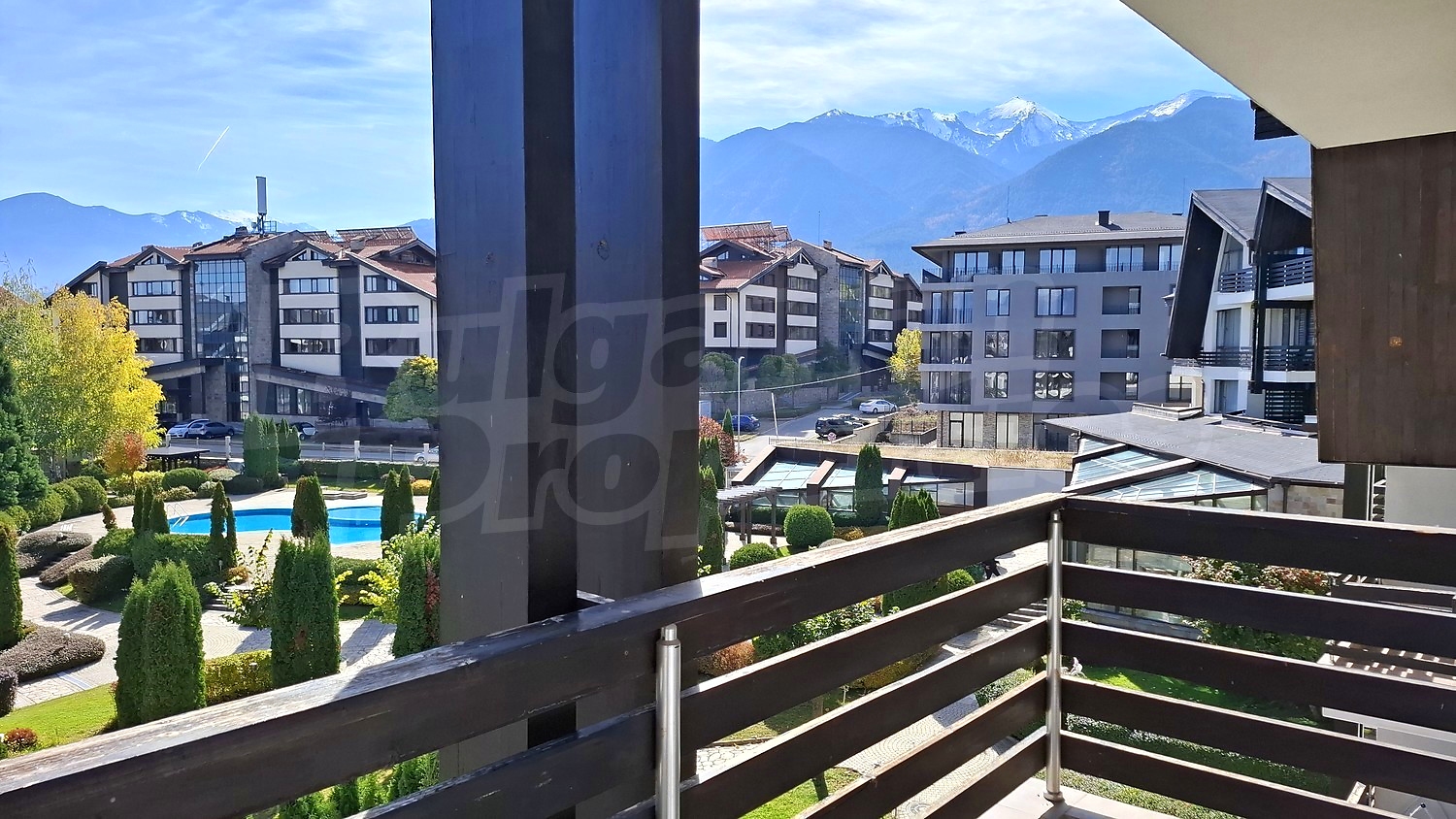 balcony, outside, view from balcony, mountains, pool, garden