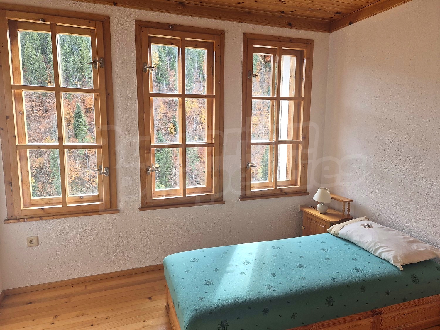 inside, bedroom, view from balcony, mountain