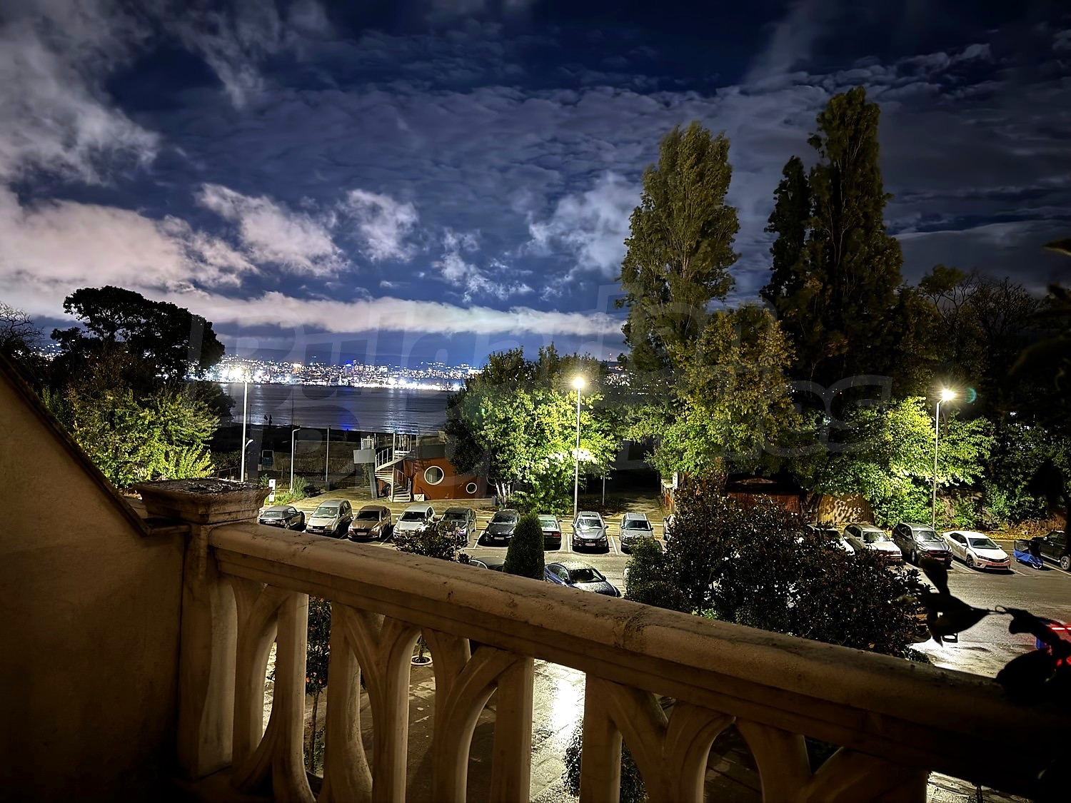 balcony, outside, view from balcony, parking, sea