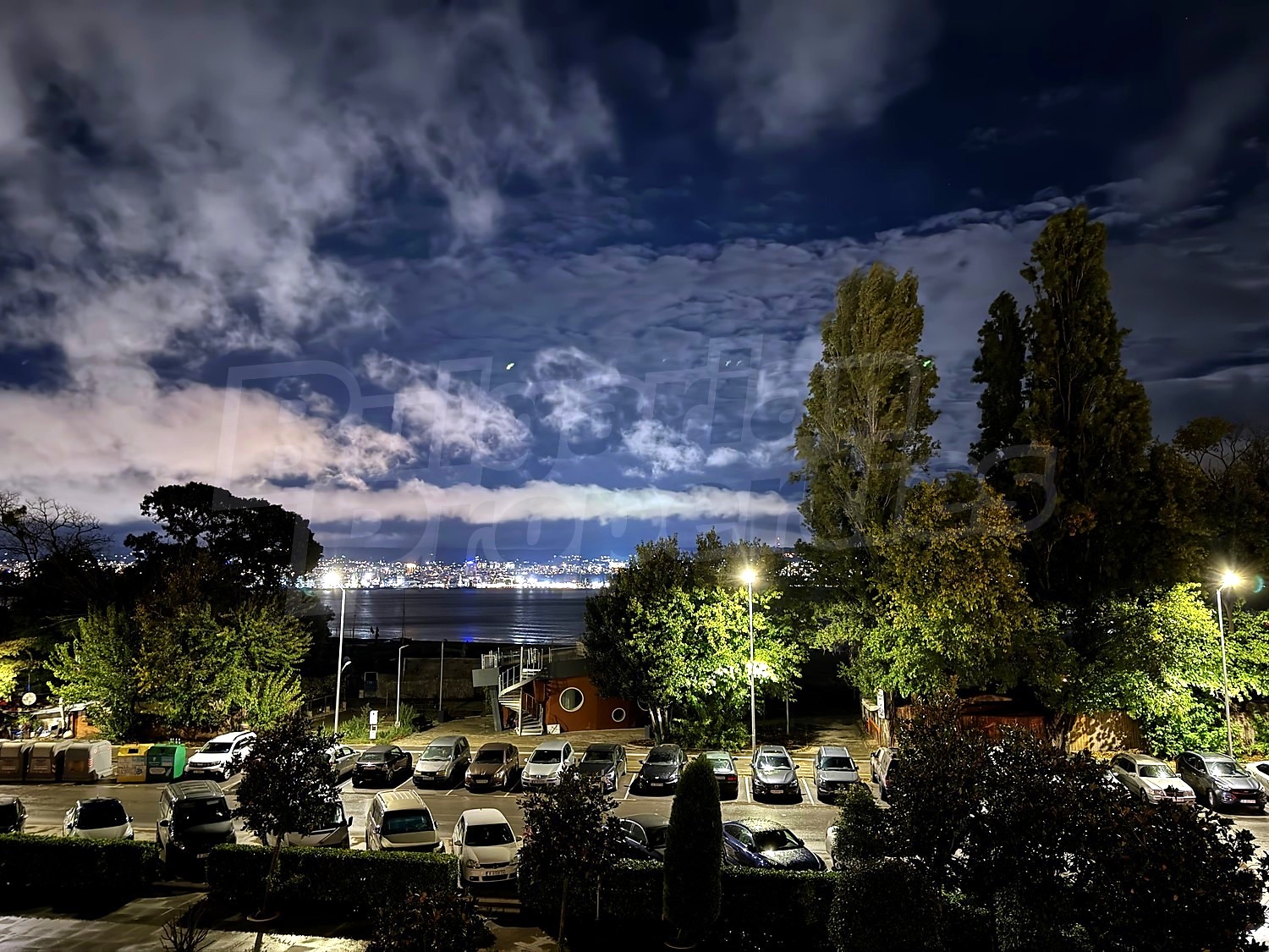 outside, parking, view from balcony, sea, night