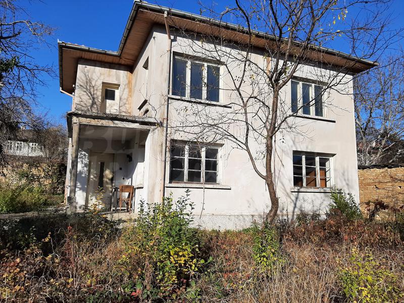 Two-storey house with garden and outbuilding Two-storey house with garden and outbuilding