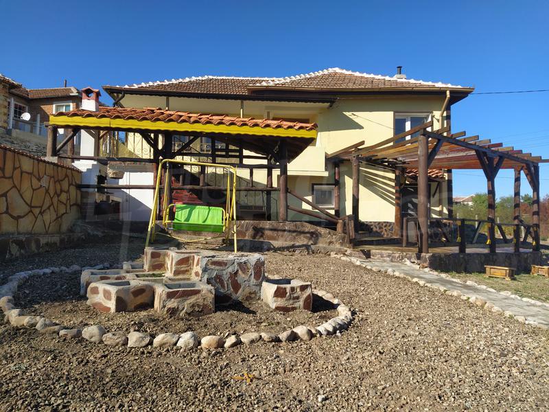 House with a garden and a barbecue House with a garden and a barbecue