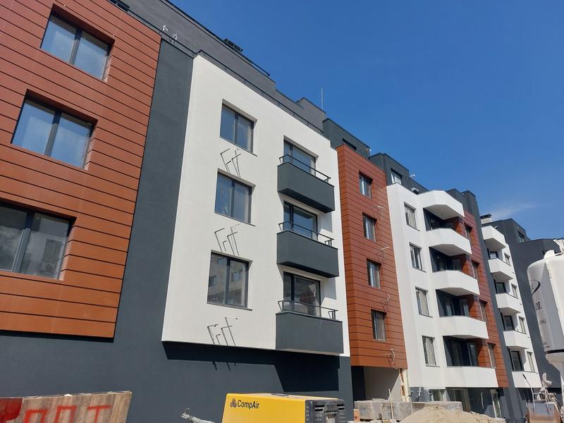 Complex of three multi-family residential buildings with garages and parking spaces Complex of three multi-family residential buildings with garages and parking spaces