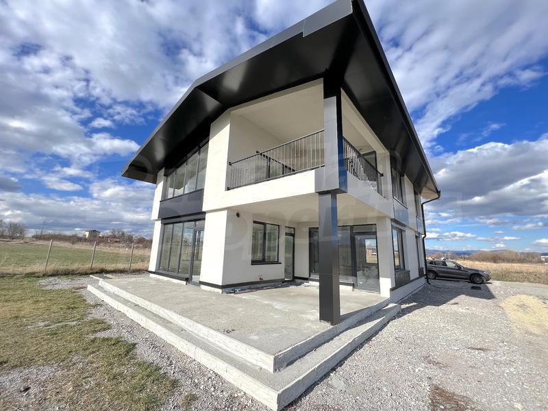 House with a yard panoramic views of the surrounding area House with a yard panoramic views of the surrounding area