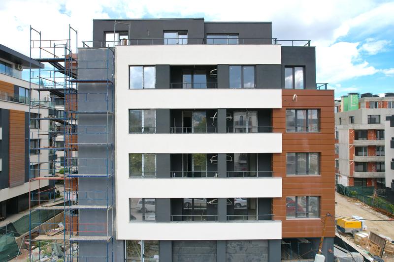 Complex of three multi-family residential buildings with garages and parking spaces Complex of three multi-family residential buildings with garages and parking spaces