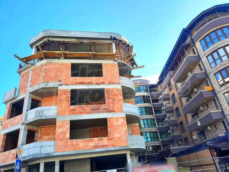 New building under construction near the center of the seaside town New building under construction near the center of the seaside town