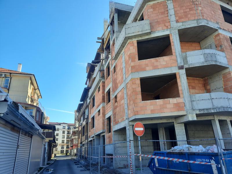 New building under construction near the center of the seaside town New building under construction near the center of the seaside town
