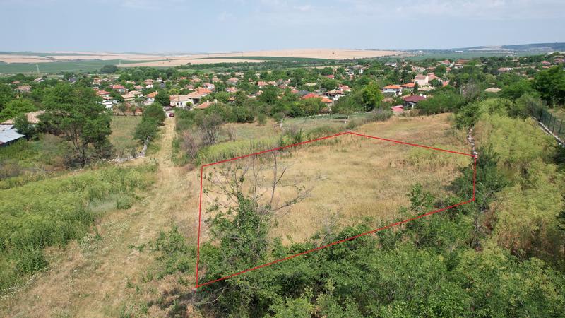 Plot of land in a nice and developed village 30 minutes from the sea capital