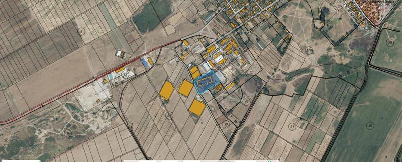 Agricultural or industrial plot with utilities and existing buildings