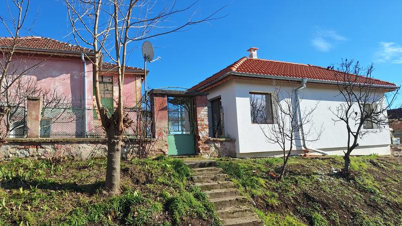 Property with two residential buildings, a spacious garden, and a quiet location