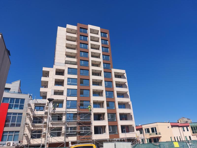 Apartments and shops in a new building near a metro station, public transport, supermarkets and a shopping center