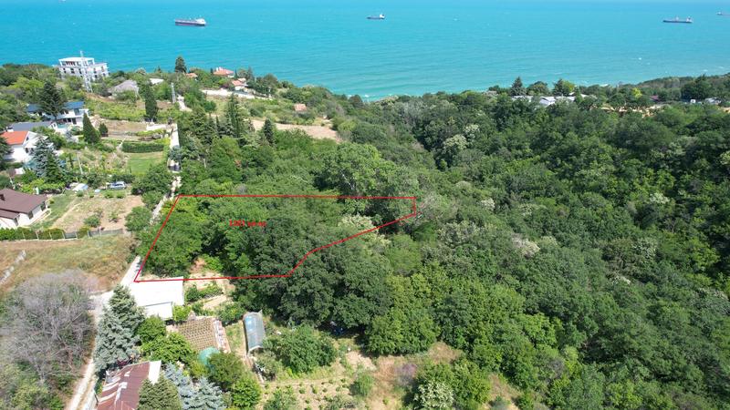 Property with sea and forest panorama near the town with potential for construction