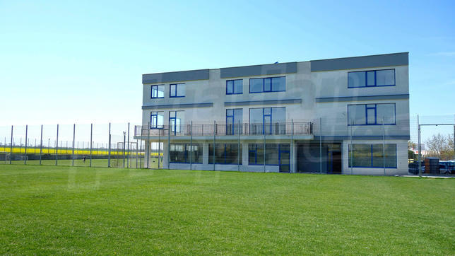 A sports facility with a hotel area and 3 soccer fields A sports facility with a hotel area and 3 soccer fields